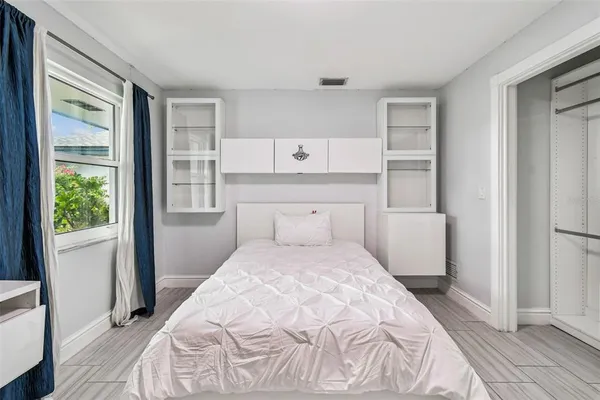 an aerial view of a houses with a lake view