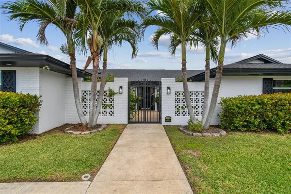 a lobby with furniture and a potted plant