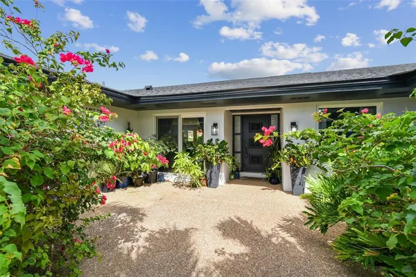 a kitchen with a table and chairs