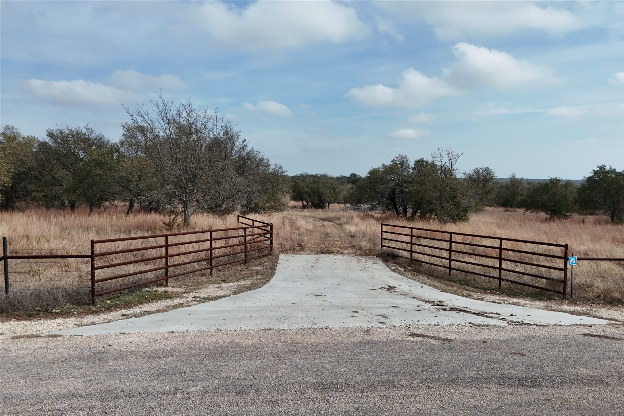 57-6 Bryce Trail Briggs, TX 78608 - Photo 11 of 11 a view of a bench with wooden fence
