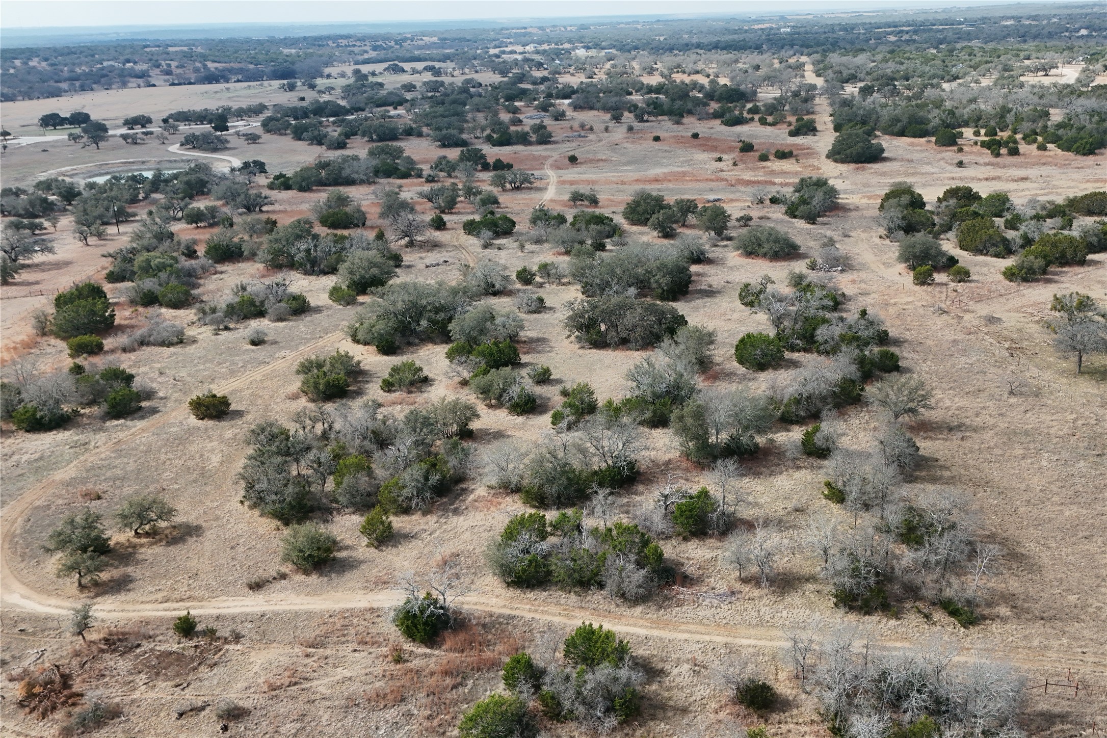 57-6 Bryce Trail Briggs, TX 78608 - Photo 4 of 11 a view of a dry field covered with snow