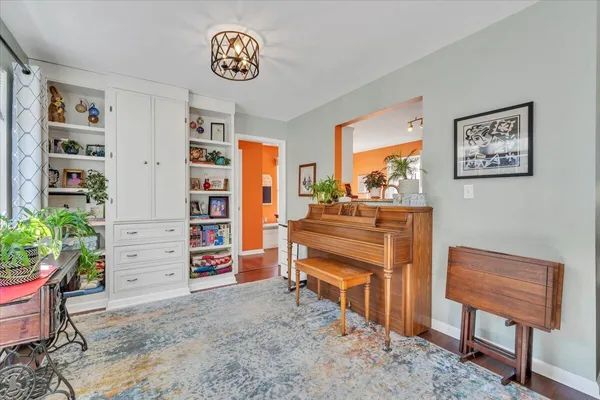 a view of a dining room with furniture and wooden floor