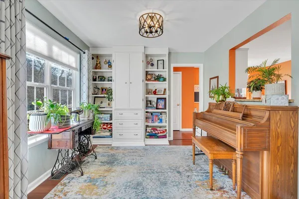 a kitchen with stainless steel appliances a stove a sink and white cabinets