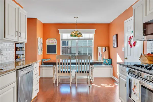 a bedroom with a large bed and a desk