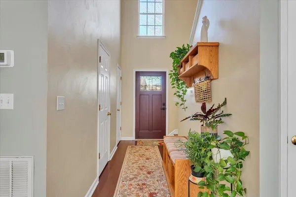 a living room with furniture a fireplace and a window