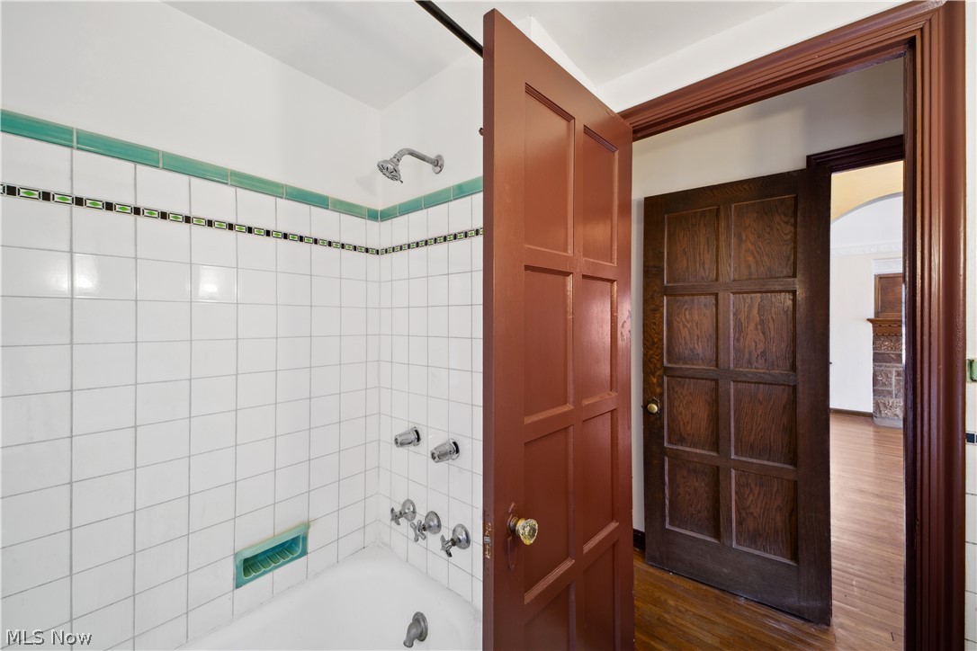 3666 Winchell Road Beachwood, OH 44122 - Photo 35 of 46 Bathroom with hardwood / wood-style floors and tiled shower / bath