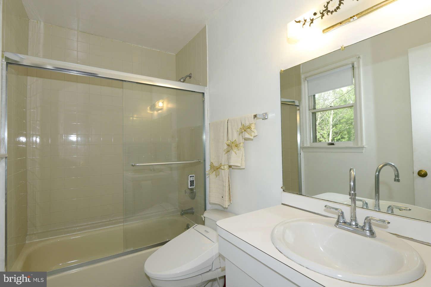 16590 Brogden Road Spencerville, MD 20868 - Photo 14 of 19 a bathroom with a sink toilet and shower