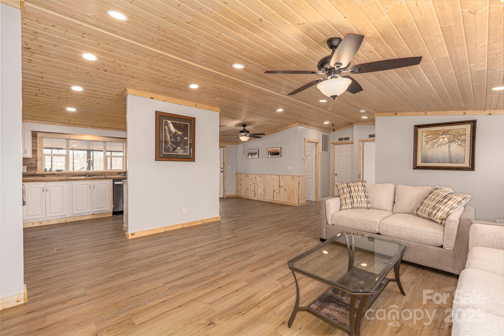 459 Vaughan Road Spruce Pine, NC 28777 - Photo 12 of 35 a living room with furniture and a wooden floor