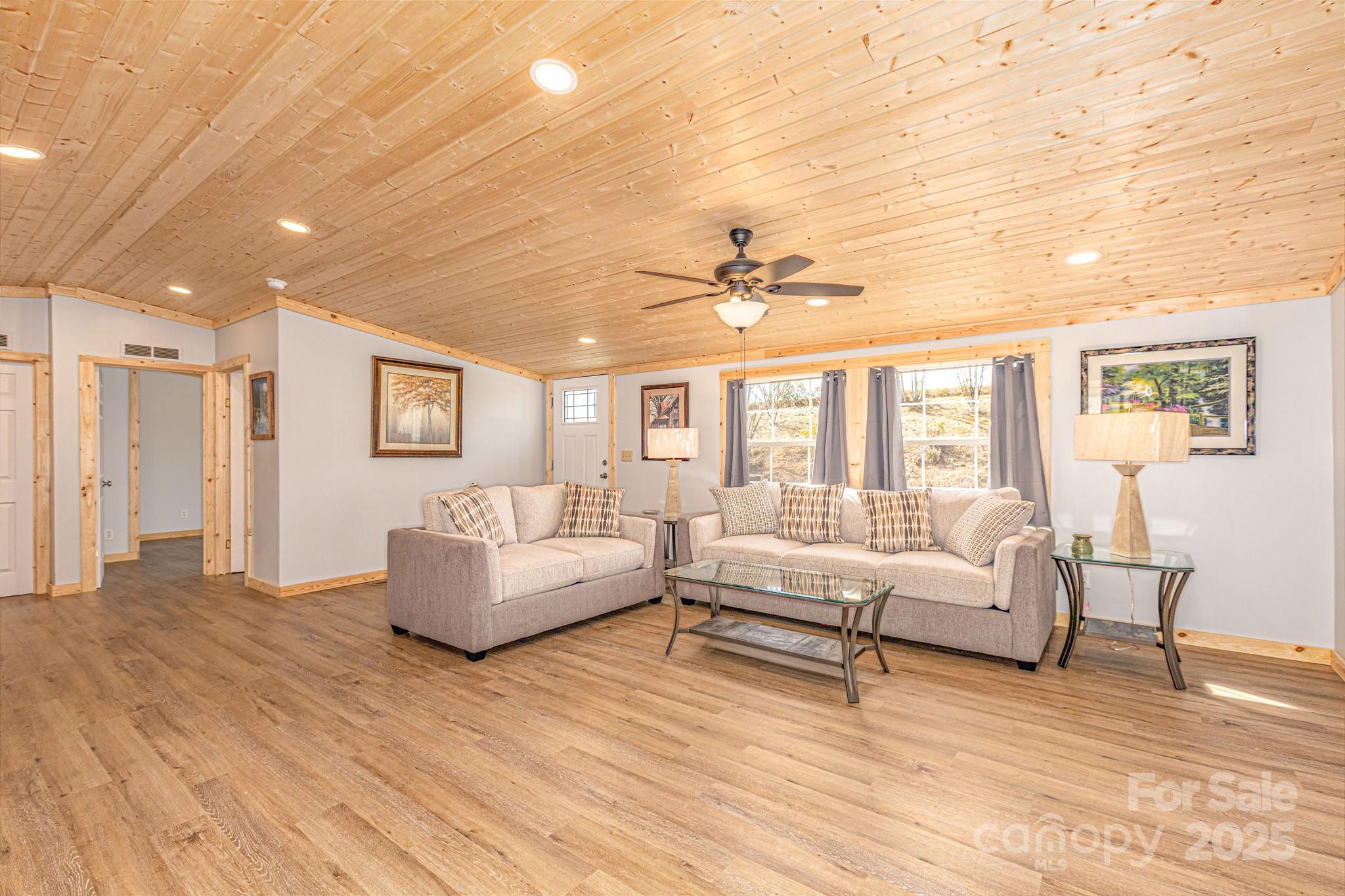 459 Vaughan Road Spruce Pine, NC 28777 - Photo 13 of 35 a living room with furniture and a large window