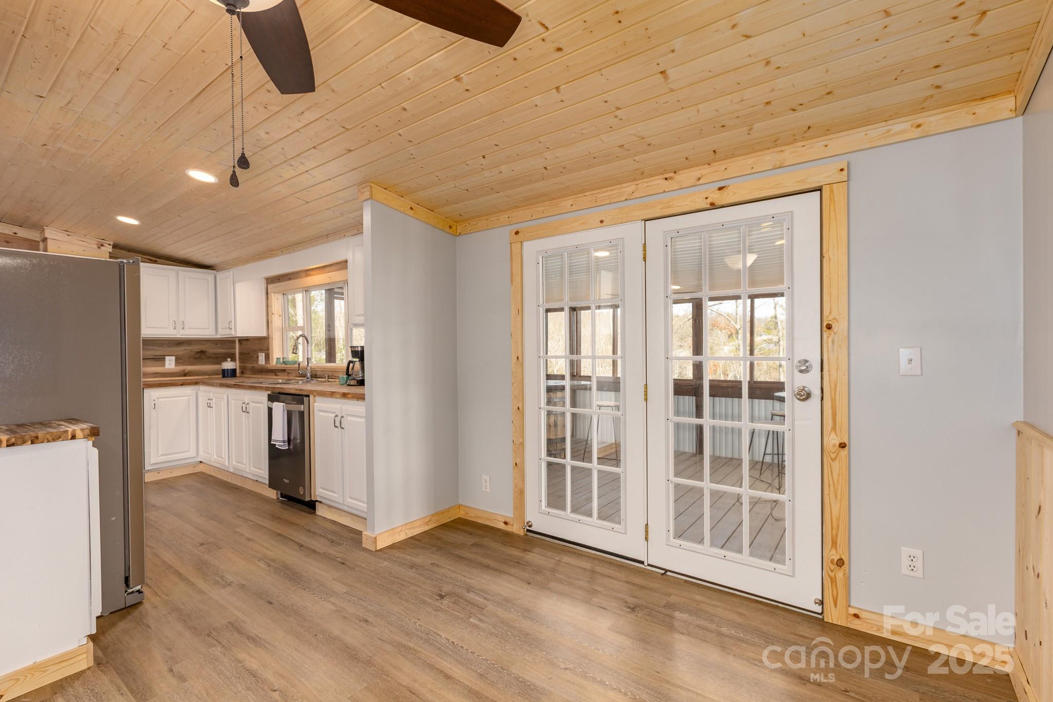 459 Vaughan Road Spruce Pine, NC 28777 - Photo 14 of 35 a view of kitchen with wooden floor and electronic appliances