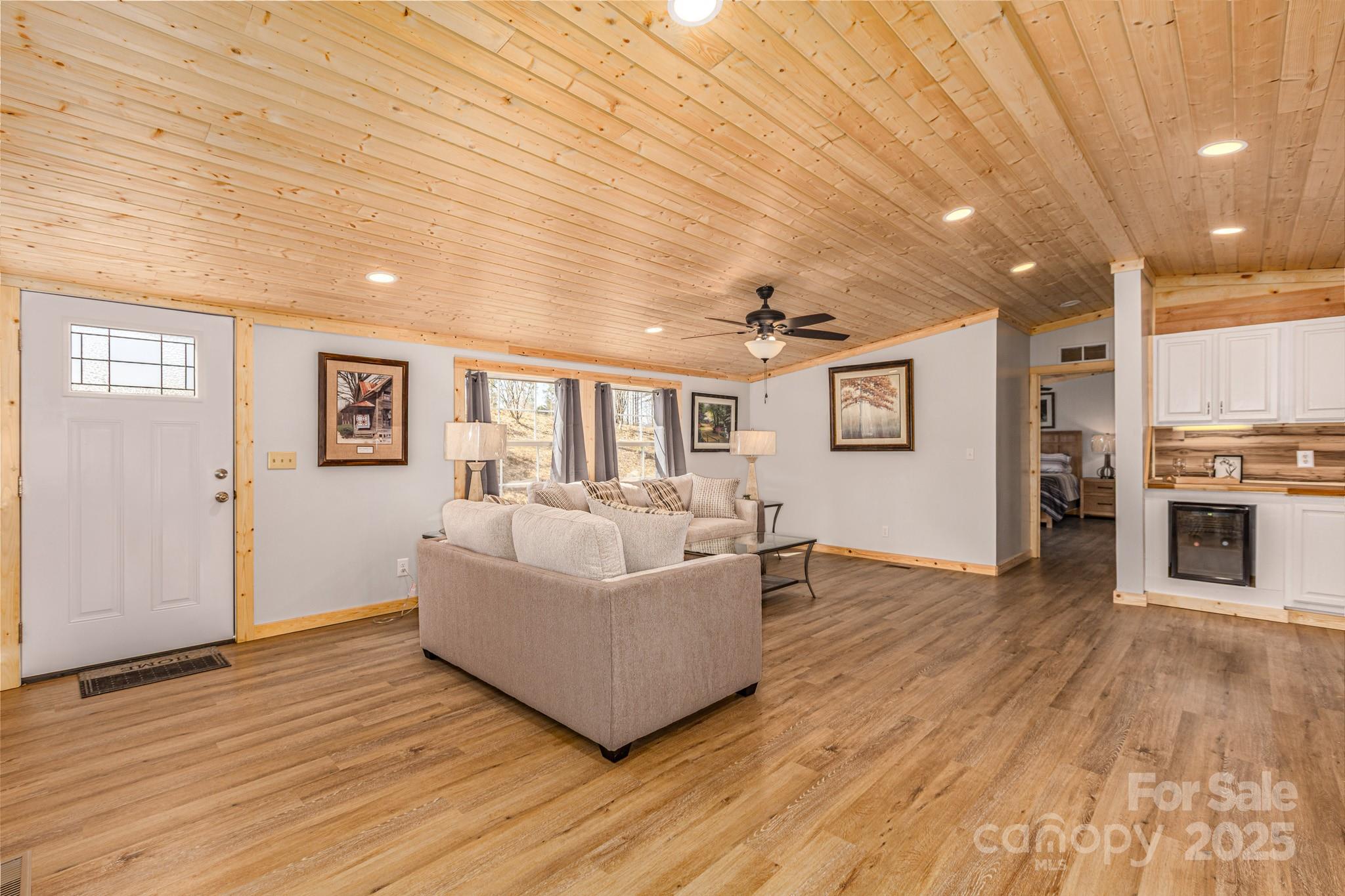 459 Vaughan Road Spruce Pine, NC 28777 - Photo 15 of 35 a living room with furniture and wooden floor