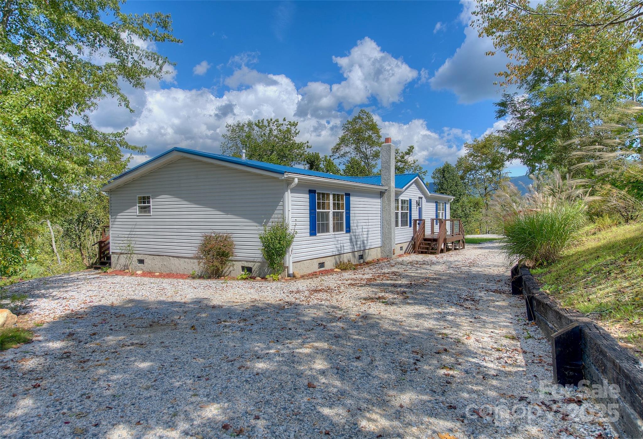 459 Vaughan Road Spruce Pine, NC 28777 - Photo 27 of 35 a view of a house with a yard