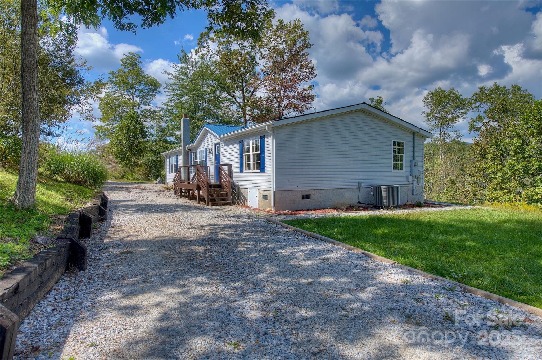 459 Vaughan Road Spruce Pine, NC 28777 - Photo 28 of 35 a view of backyard of house with green space