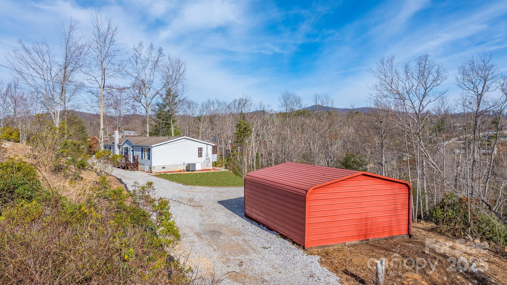 459 Vaughan Road Spruce Pine, NC 28777 - Photo 29 of 35 a front view of a house with a yard and large tree