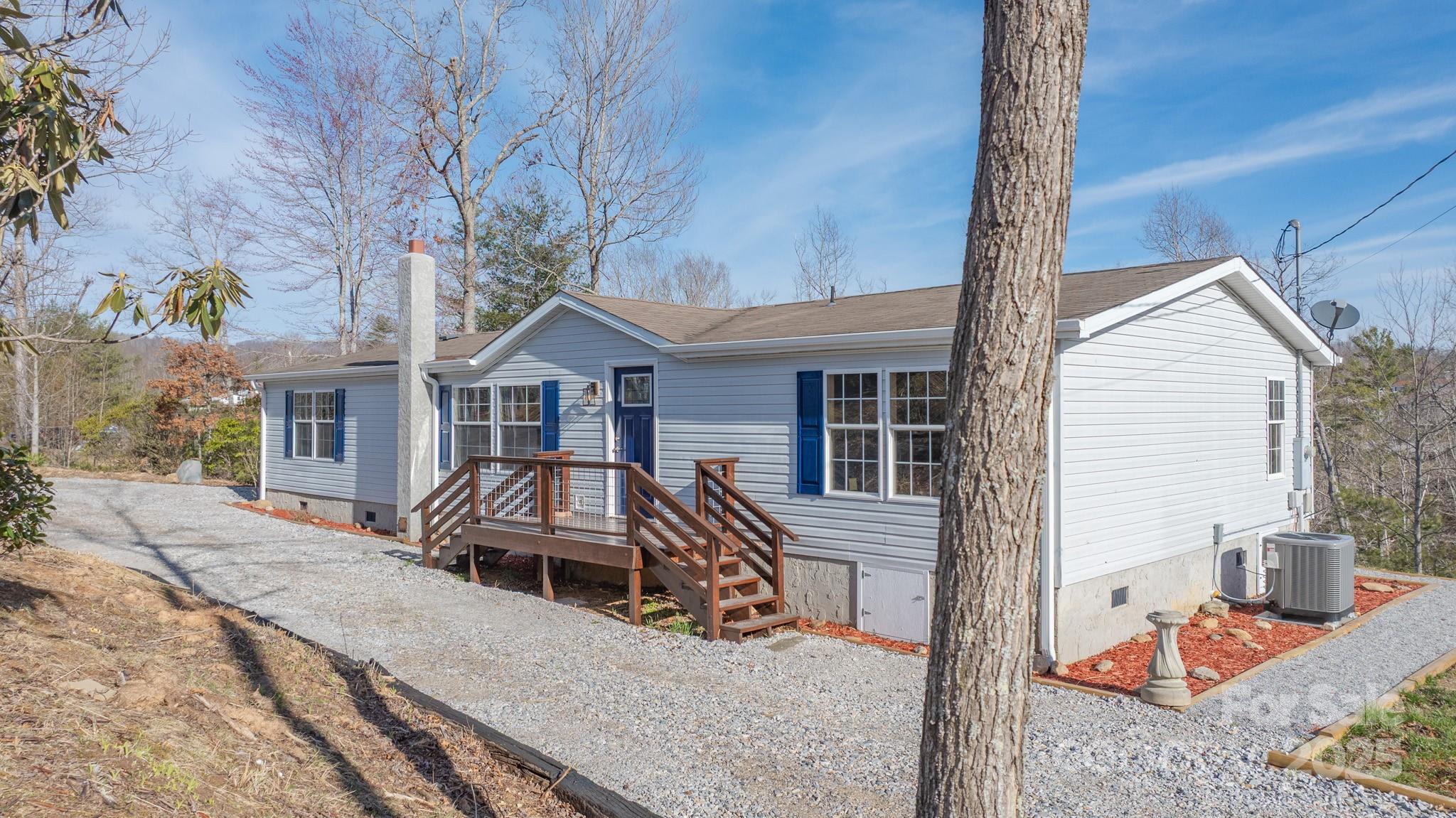 459 Vaughan Road Spruce Pine, NC 28777 - Photo 32 of 35 a front view of a house with parking space