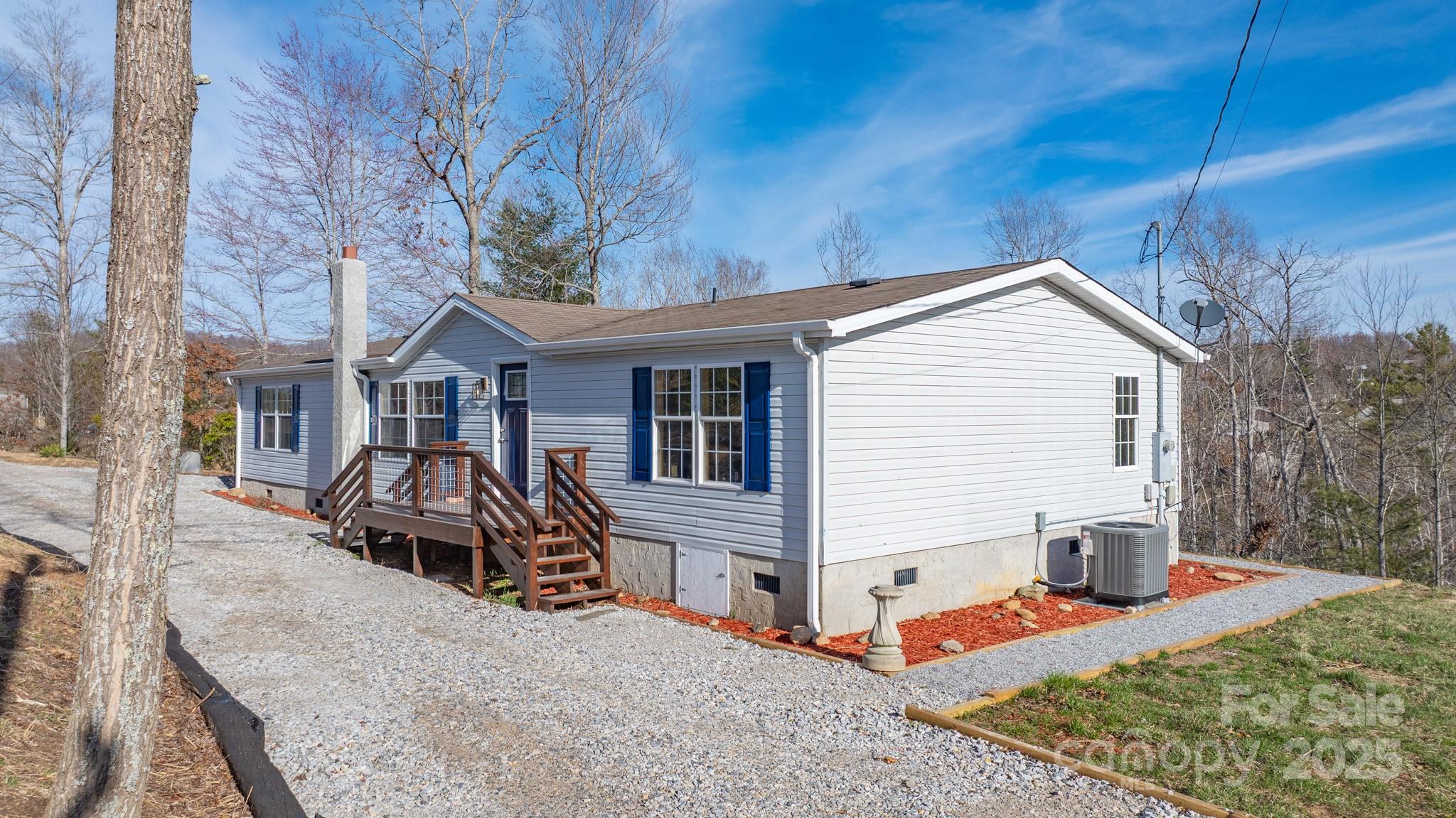 459 Vaughan Road Spruce Pine, NC 28777 - Photo 34 of 35 a front view of a house with a yard