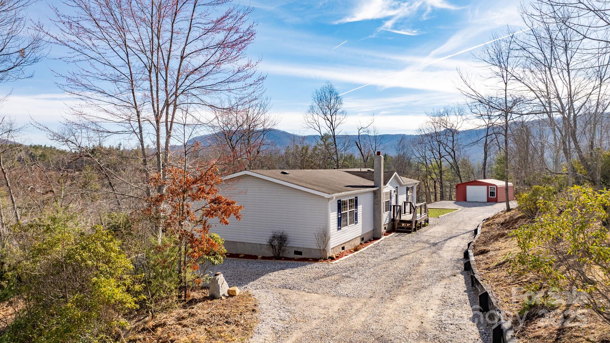 459 Vaughan Road Spruce Pine, NC 28777 - Photo 4 of 35 a view of a house with a yard