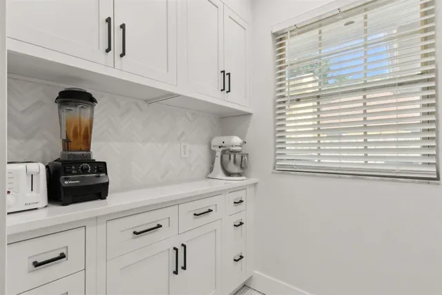 a view of a backyard with sitting area