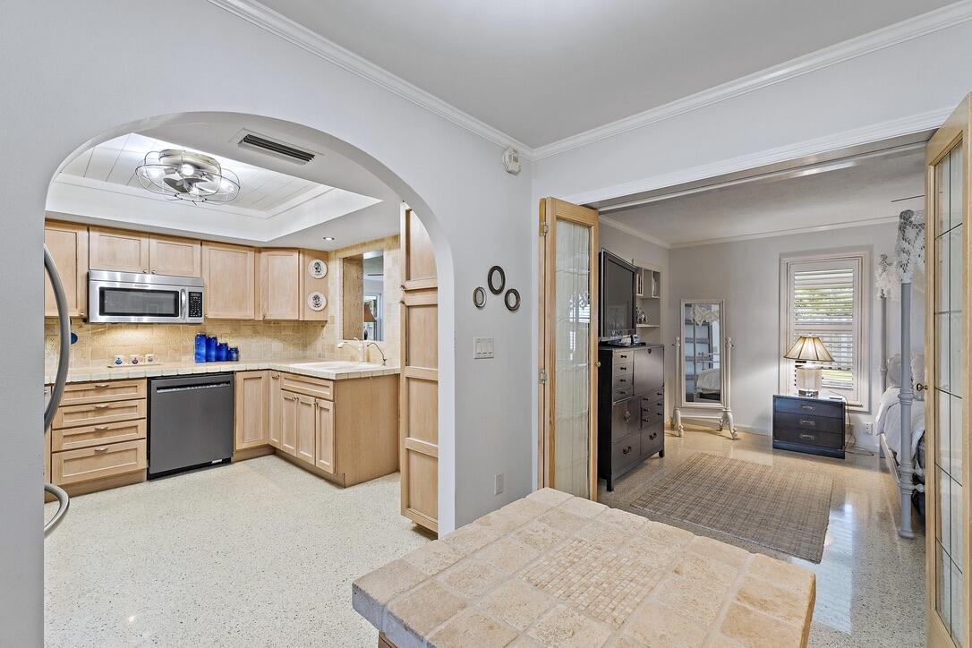 4844 Southeast Pilot Way Stuart, FL 34997 - Photo 15 of 41 a large kitchen with cabinets and stainless steel appliances