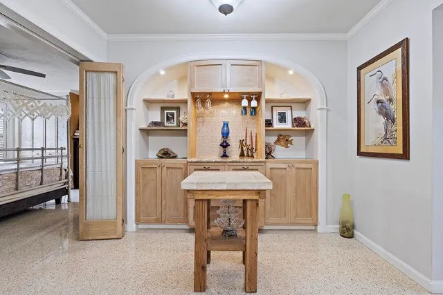 a view of living room filled with furniture and window