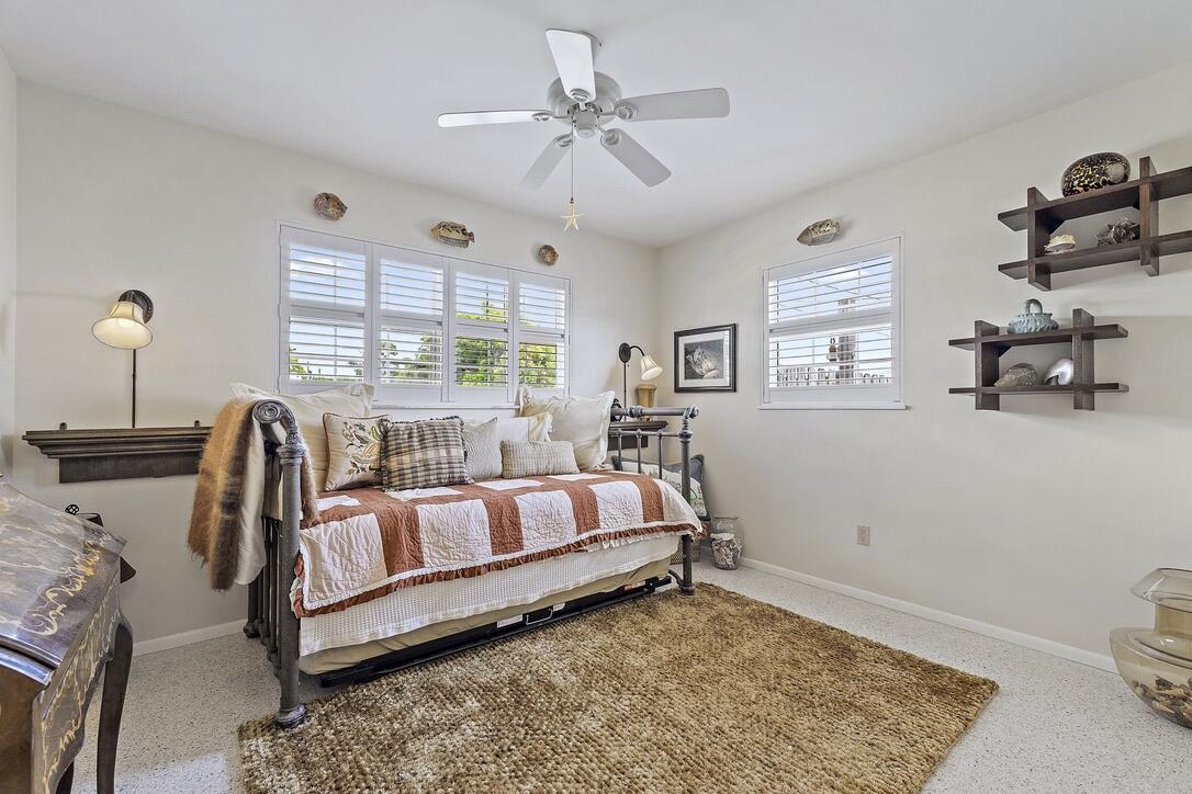 4844 Southeast Pilot Way Stuart, FL 34997 - Photo 20 of 41 a bedroom with furniture and a window