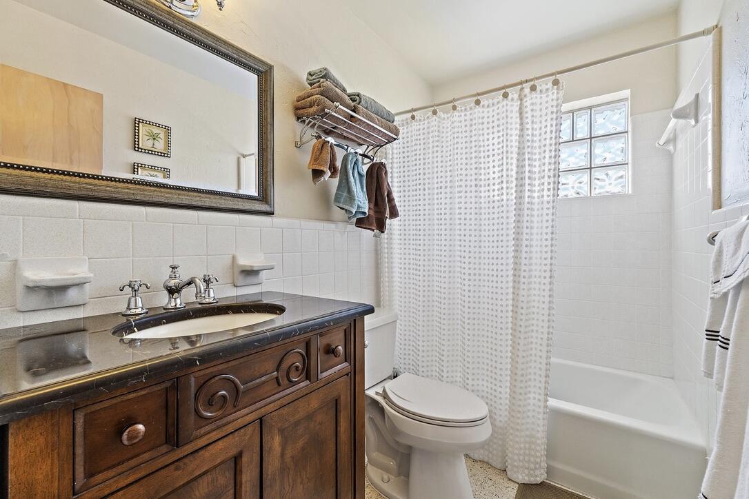 4844 Southeast Pilot Way Stuart, FL 34997 - Photo 24 of 41 a bathroom with a sink a toilet and shower