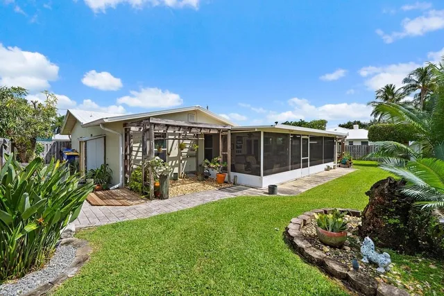 a garden with palm trees
