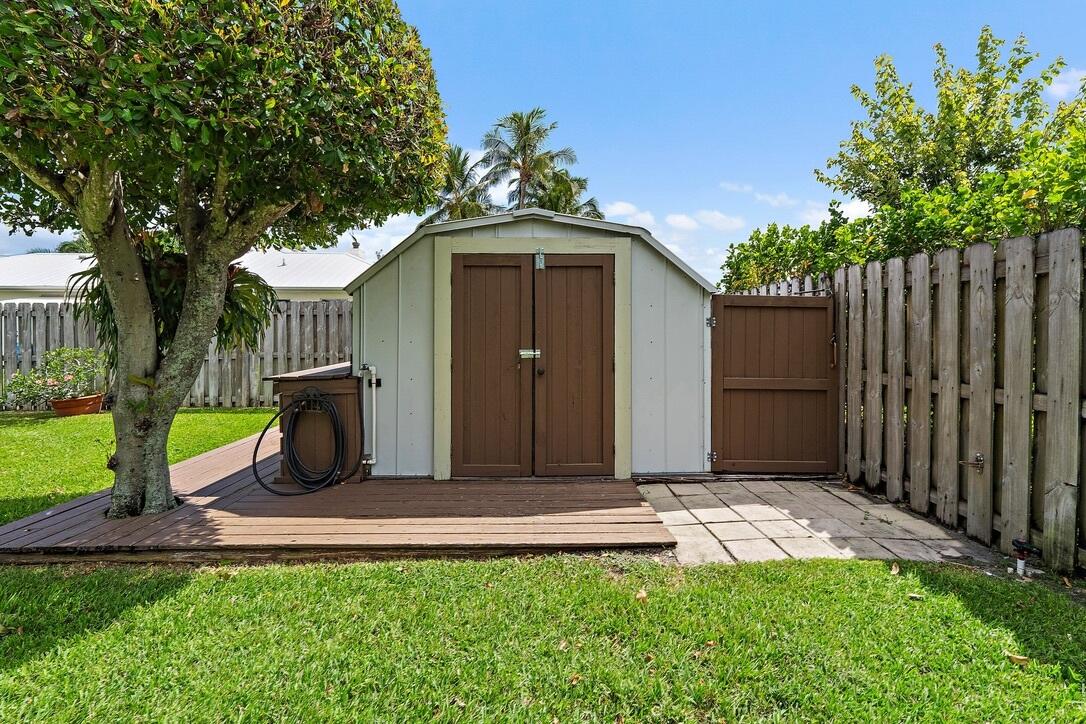 4844 Southeast Pilot Way Stuart, FL 34997 - Photo 29 of 41 a front view of a house with garden