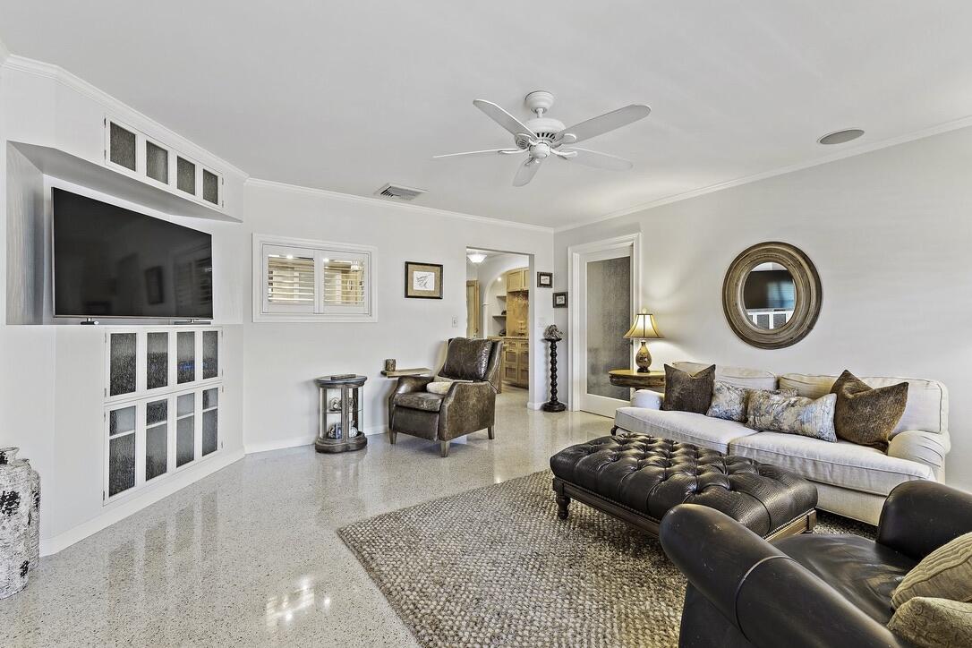 4844 Southeast Pilot Way Stuart, FL 34997 - Photo 3 of 41 a living room with furniture and a flat screen tv