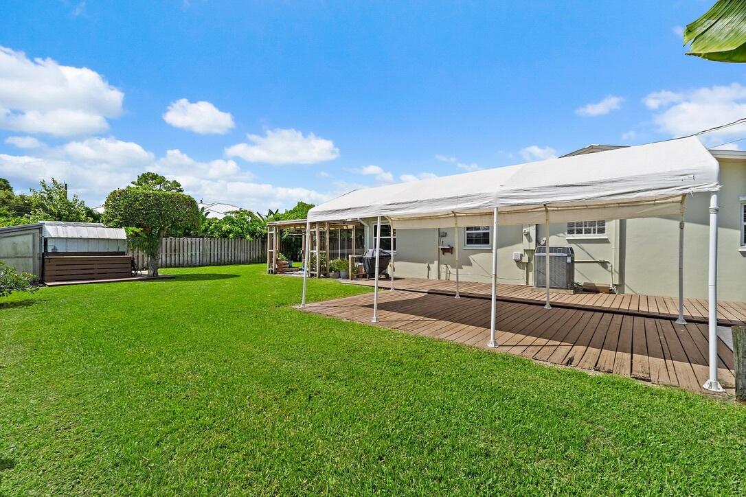 4844 Southeast Pilot Way Stuart, FL 34997 - Photo 33 of 41 a view of house with a big yard