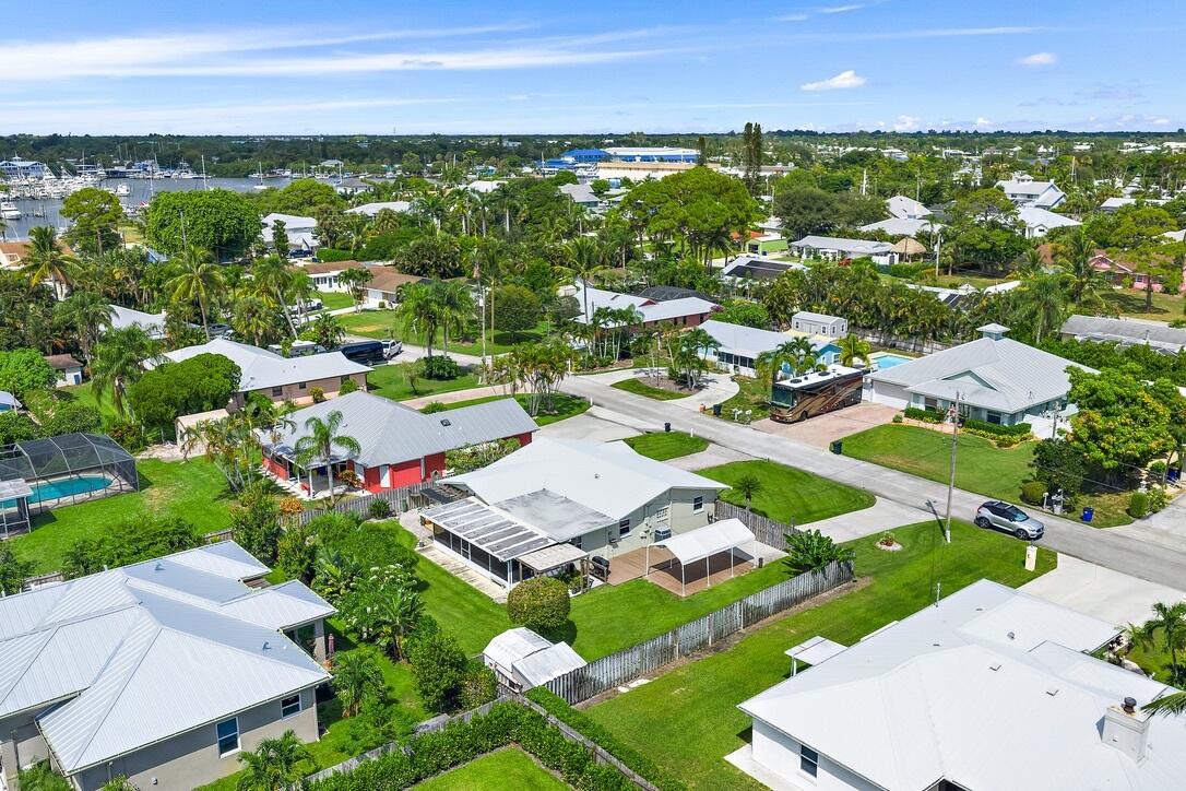 4844 Southeast Pilot Way Stuart, FL 34997 - Photo 36 of 41 an aerial view of residential houses with outdoor space and street view