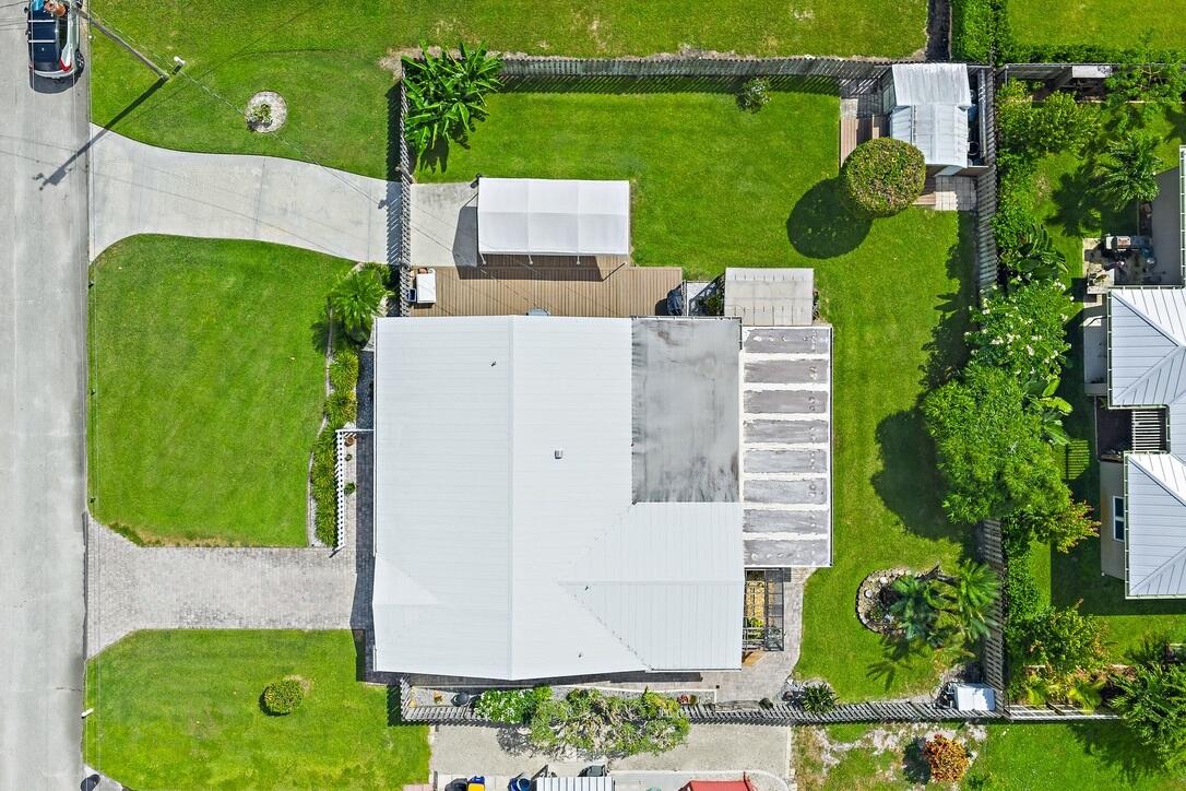 4844 Southeast Pilot Way Stuart, FL 34997 - Photo 37 of 41 an aerial view of a house with a swimming pool and outdoor space