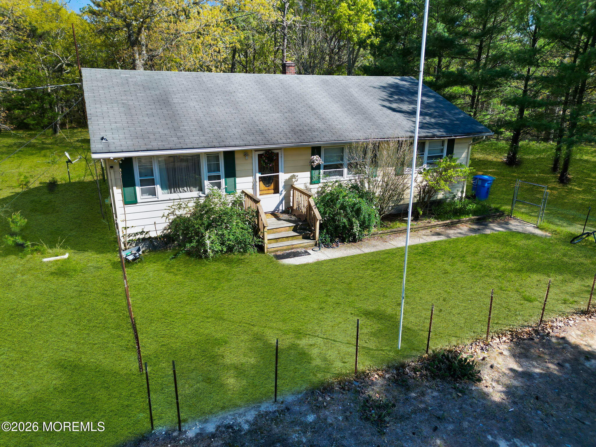 635 Bennetts Mills Road Jackson, NJ 08527 - Photo 2 of 18 a front view of a house with garden