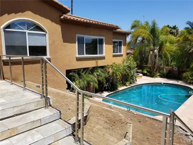 a view of swimming pool with a patio