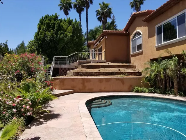a view of swimming pool with a yard