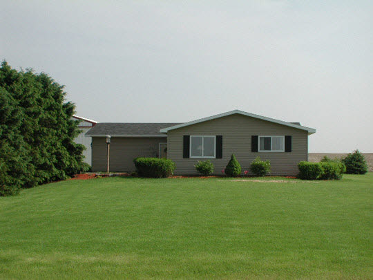 13429 East Dutch Road Rochelle, IL 61068 - Photo 1 of 1 a front view of house with yard and green space