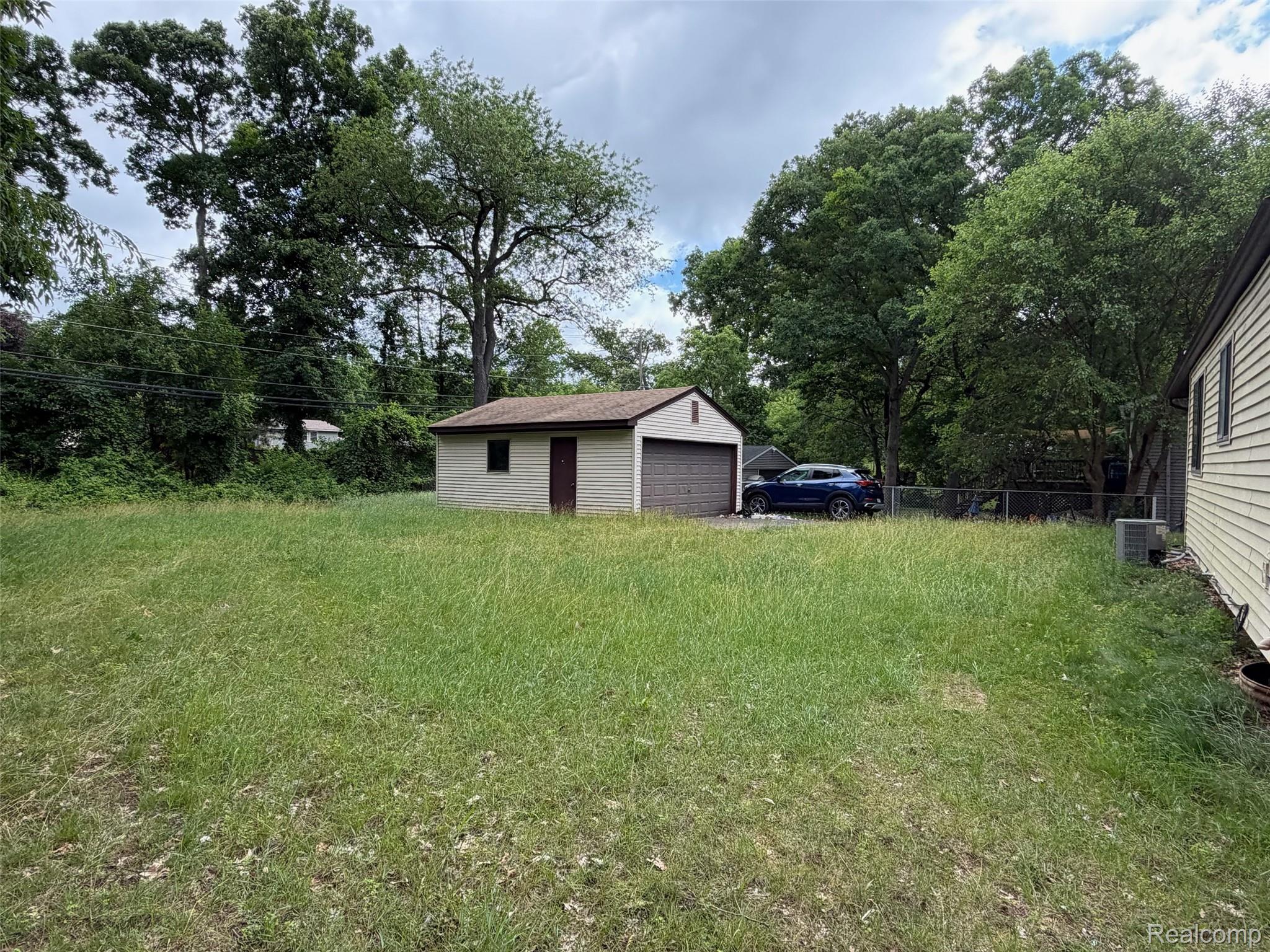 718 West Baker Road Highland, MI 48357 - Photo 8 of 12 Backyard