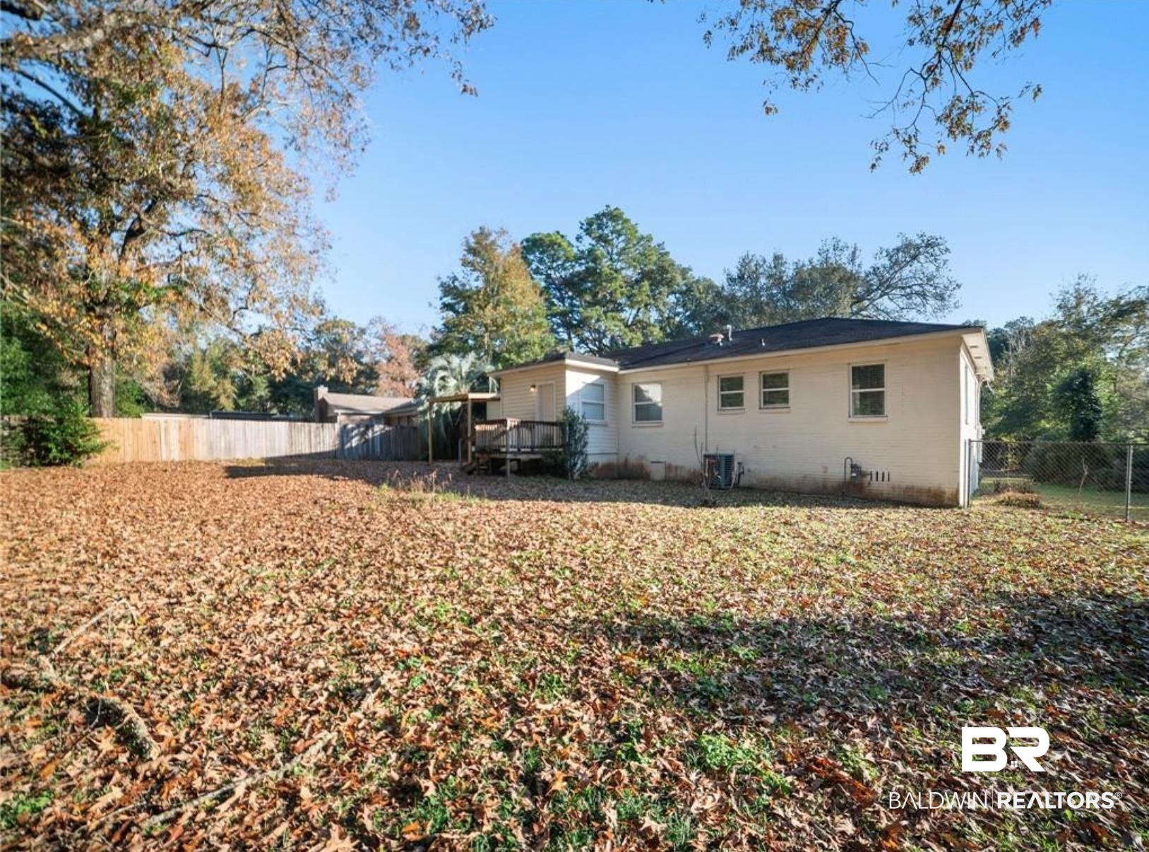 1420 Vega Drive Mobile, AL 36693 - Photo 15 of 18 Rear view of house featuring a fenced backyard and a deck