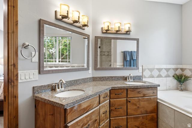 3148 Lower Saddleback Road Park City, UT 84098 - Photo 40 of 67 Dual vanity with granite countertops, undermount sinks, and wood cabinetry