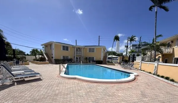 a view of a swimming pool with a patio