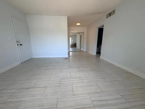 a view of a hallway with closet