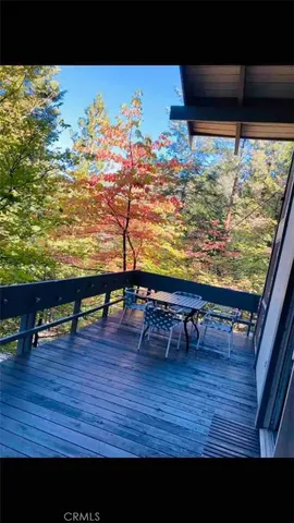a view of a swimming pool with furniture