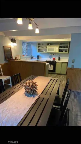 a kitchen with a table and chairs