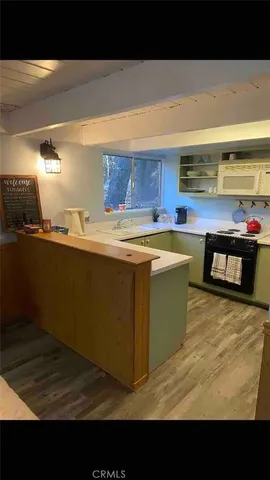 a kitchen with stainless steel appliances a sink and a stove