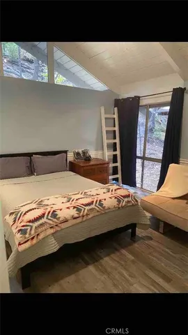 a view of bedroom with furniture