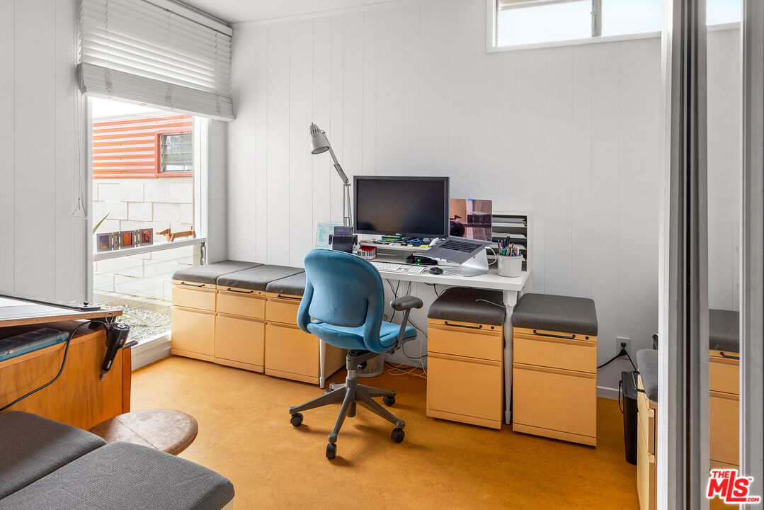 721 Rochedale Way Los Angeles, CA 90049 - Photo 16 of 25 a view of a workspace with furniture and a window