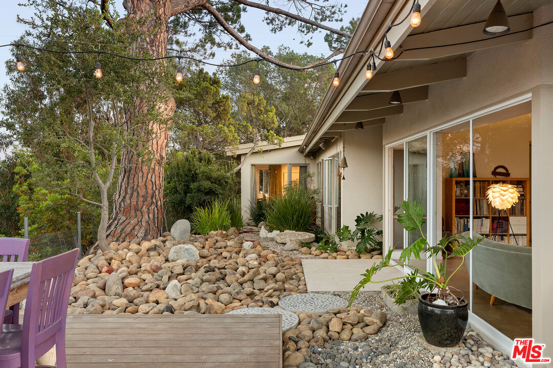 721 Rochedale Way Los Angeles, CA 90049 - Photo 17 of 25 a view of a house with backyard