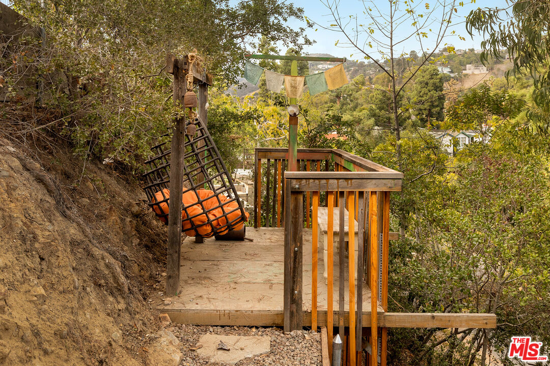 721 Rochedale Way Los Angeles, CA 90049 - Photo 22 of 25 a view of a house with a tree