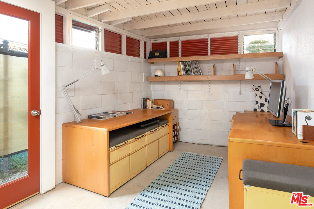 721 Rochedale Way Los Angeles, CA 90049 - Photo 23 of 25 a kitchen with stainless steel appliances granite countertop a stove and a cabinets