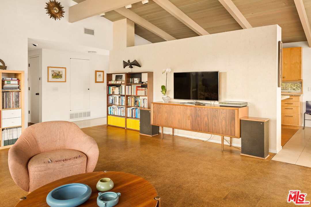 721 Rochedale Way Los Angeles, CA 90049 - Photo 6 of 25 a living room with furniture and a flat screen tv